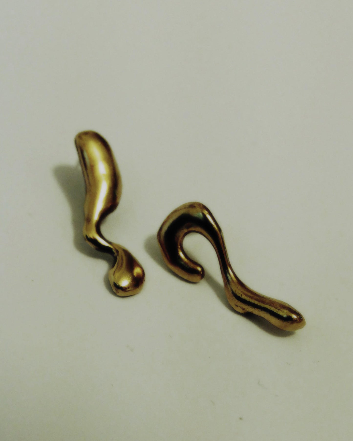 Handcrafted gold unique abstract earrings. Sustainable jewellery. London based jewellery brand.