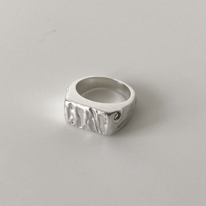 Unique molten silver signet ring, handcrafted in recycled materials and metal. Handmade in London. 